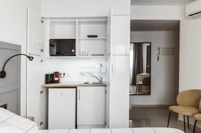 Una cocina o zona de cocina en Exclusive Rooms in the Heart of the City