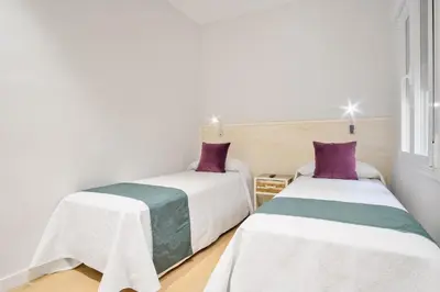 Cama o camas de una habitación en Stylish 3-Bed Apartment in Madrid’s Golden Mile