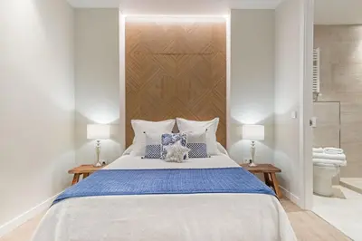 Cama o camas de una habitación en Spacious 3-Bed Apartment in Chueca Madrid