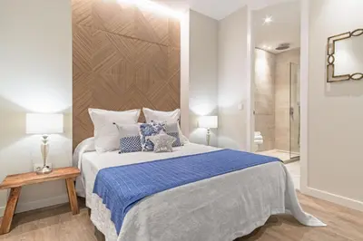 Cama o camas de una habitación en Spacious 3-Bed Apartment in Chueca Madrid