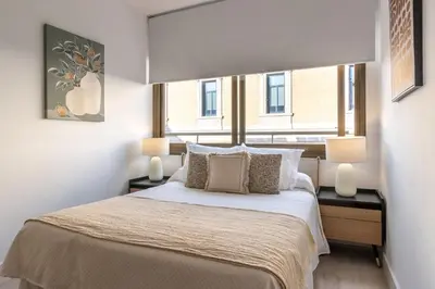 Cama o camas de una habitación en Cozy Elegant Studio in Villanueva Madrid