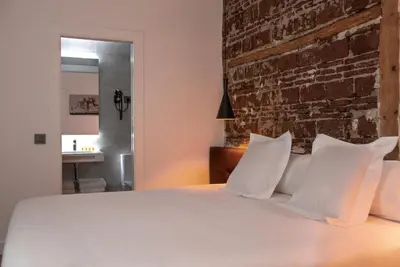 Cama o camas de una habitación en Woohoo Rooms Fuencarral