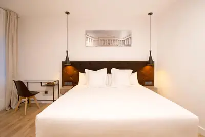 Cama o camas de una habitación en Woohoo Rooms Fuencarral