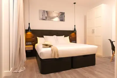 Cama o camas de una habitación en Woohoo Rooms Fuencarral
