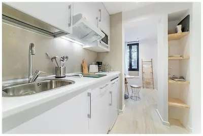 Una cocina o zona de cocina en Apartamentos Madrid Rio