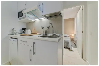 Una cocina o zona de cocina en Apartamentos Madrid Rio