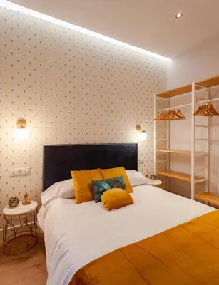 Cama o camas de una habitación en MIMA Suites Chueca