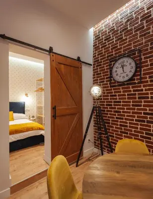 Cama o camas de una habitación en MIMA Suites Chueca