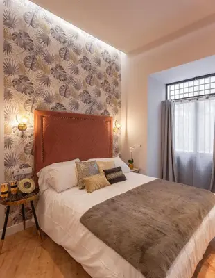 Cama o camas de una habitación en MIMA Suites Chueca
