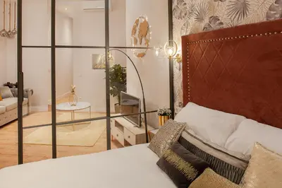 Cama o camas de una habitación en MIMA Suites Chueca