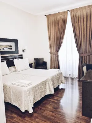Cama o camas de una habitación en Hostal Mayor