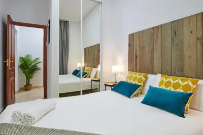 Cama o camas de una habitación en LEEWAYS APARTMENT in GRAN VÍA XIV