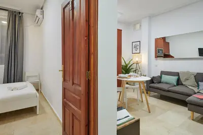Cama o camas de una habitación en LEEWAYS APARTMENT in GRAN VÍA XIV