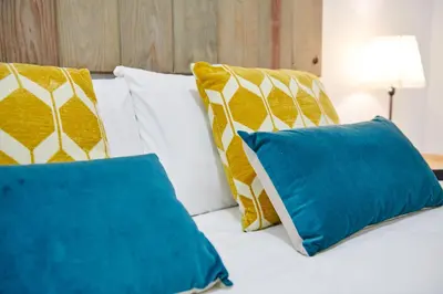 Cama o camas de una habitación en LEEWAYS APARTMENT in GRAN VÍA XIV