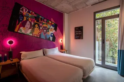 Cama o camas de una habitación en The Central House Madrid Lavapiés