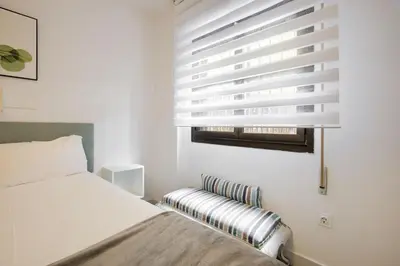 Cama o camas de una habitación en Dobo Madrid Ventas