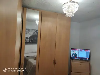 Una televisión o centro de entretenimiento en Alojamiento LT
