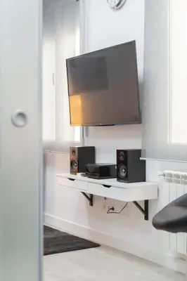 Una televisión o centro de entretenimiento en Gran Vía Apartment