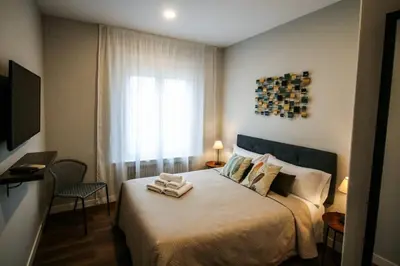 Cama o camas de una habitación en Apartamento con Terraza a Gran Vía y Palacio Real