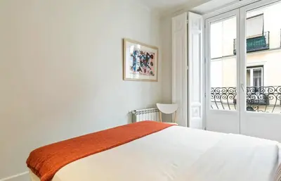Cama o camas de una habitación en Waou Chueca III - Alquiler Corta Duración