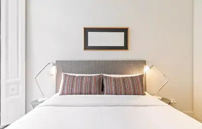 Cama o camas de una habitación en Waou Chueca III - Alquiler Corta Duración