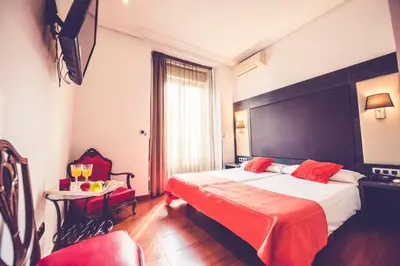 Cama o camas de una habitación en Hostal Sol Los Angeles