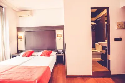 Cama o camas de una habitación en Hostal Sol Los Angeles