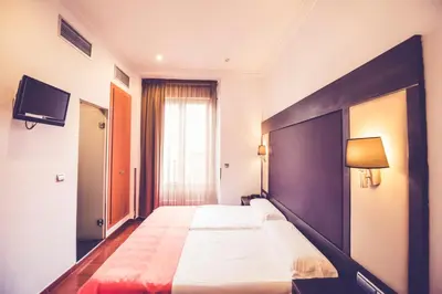 Cama o camas de una habitación en Hostal Sol Los Angeles