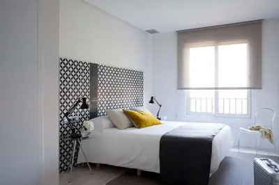 Cama o camas de una habitación en Eric Vökel Boutique Apartments - Atocha Suites
