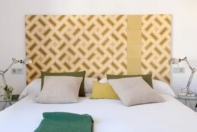 Cama o camas de una habitación en Eric Vökel Boutique Apartments - Atocha Suites