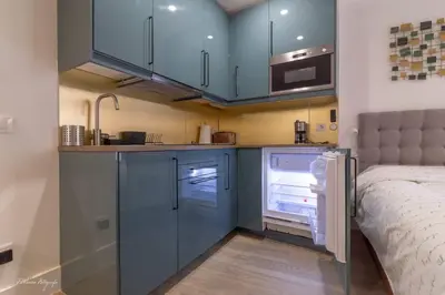 Una cocina o zona de cocina en Moderno y funcional apartamento en el centro-El rastro