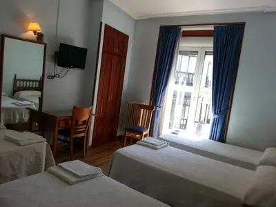 Cama o camas de una habitación en Hostal Guerra
