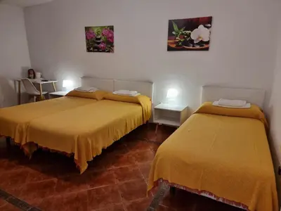 Cama o camas de una habitación en Casa de Huéspedes Cuenca