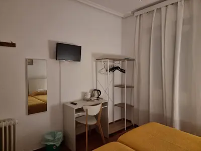 Cama o camas de una habitación en Casa de Huéspedes Cuenca