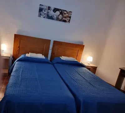 Cama o camas de una habitación en Casa de Huéspedes Cuenca