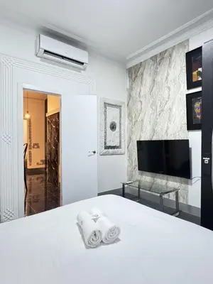 Cama o camas de una habitación en Apartamentos Day Madrid MALASAÑA I
