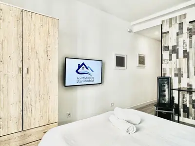 Cama o camas de una habitación en Apartamentos Day Madrid CALLAO I