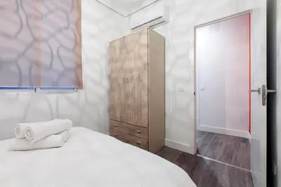 Cama o camas de una habitación en Apartamentos Day Madrid CALLAO I