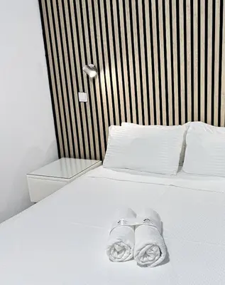 Cama o camas de una habitación en Apartamentos Day Madrid CALLAO I