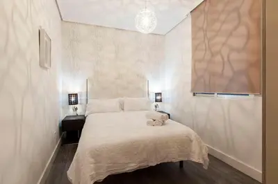 Cama o camas de una habitación en Apartamentos Day Madrid CALLAO I