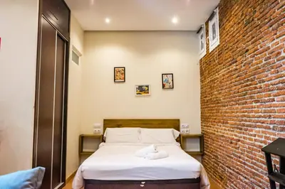 Cama o camas de una habitación en Acogedor estudio en Cuatro Caminos by beBalmy