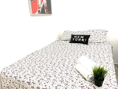 Cama o camas de una habitación en Estudio en Goya junto a Movistar Arena