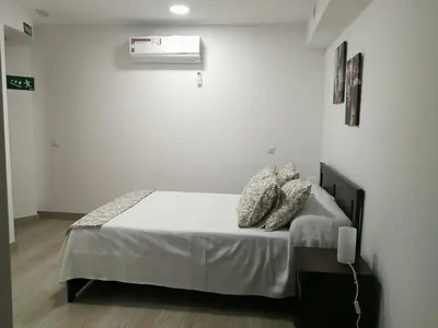 Cama o camas de una habitación en L&G Madrid Apartments