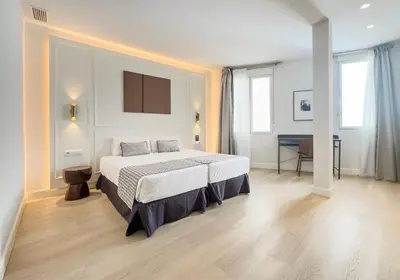 Cama o camas de una habitación en Ópera Stays by Charming