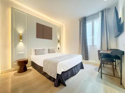 Cama o camas de una habitación en Ópera Stays by Charming
