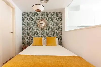 Cama o camas de una habitación en Heima Gran Vía A