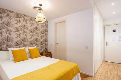Cama o camas de una habitación en Heima Gran Vía B
