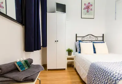 Cama o camas de una habitación en Sweet Gran Via II
