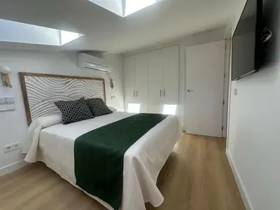 Cama o camas de una habitación en LOFTS Puerta del SOL