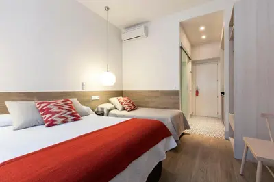 Cama o camas de una habitación en LOFTS Puerta del SOL